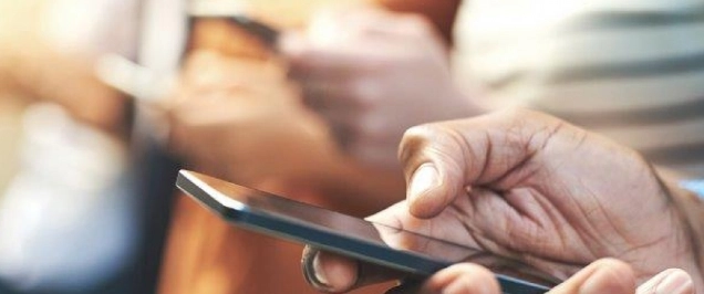 Image of a person holding a phone